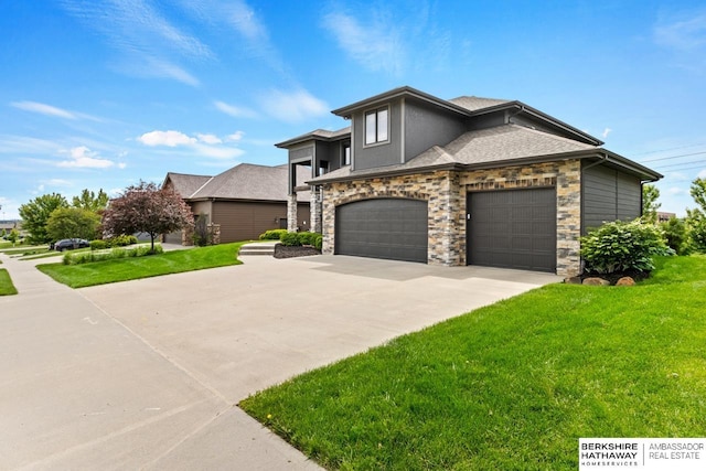 1220 S 200th Ave, Omaha, NE 68130 - view of front of house featuring concrete driveway, a front lawn, stone siding, and roof with shingles