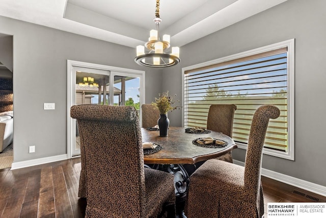 1220 S 200th Ave, Omaha, NE 68130 - dining room with baseboards, a chandelier, dark wood finished floors, and a tray ceiling