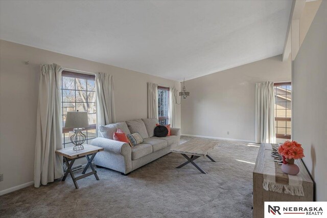 1615 S 136th St, Omaha, NE 68144 - carpeted living room featuring baseboards and vaulted ceiling