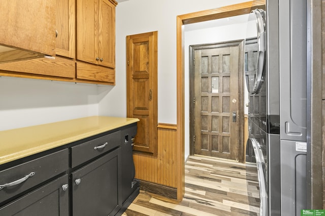 8259 Paradise Hills Ln, Fort Calhoun, NE 68023 - kitchen with light wood finished floors, dark cabinetry, and light countertops