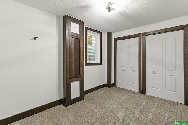 8259 Paradise Hills Ln, Fort Calhoun, NE 68023 - unfurnished bedroom with carpet, baseboards, and a textured ceiling