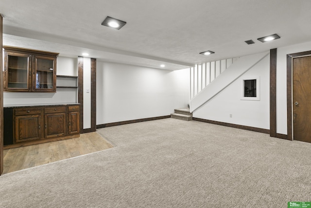 8259 Paradise Hills Ln, Fort Calhoun, NE 68023 - finished basement with light colored carpet, stairway, baseboards, and recessed lighting