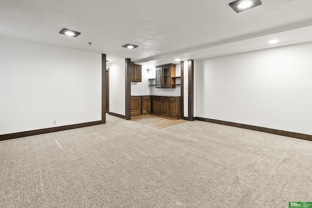 8259 Paradise Hills Ln, Fort Calhoun, NE 68023 - unfurnished living room with light colored carpet, baseboards, and recessed lighting