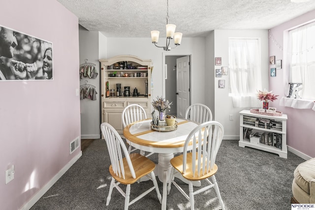 5335 N 26th St, Omaha, NE 68111 - carpeted dining room featuring a textured ceiling, a chandelier, and baseboards