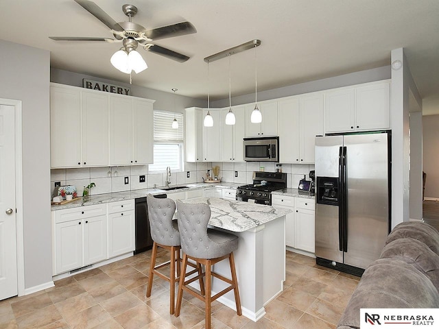 7941 N 152nd St, Bennington, NE 68007 - kitchen with appliances with stainless steel finishes, a sink, white cabinetry, and tasteful backsplash