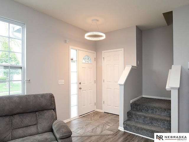 7941 N 152nd St, Bennington, NE 68007 - foyer entrance featuring healthy amount of natural light, baseboards, and stairs