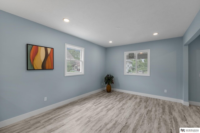 2306 Ogden St, Omaha, NE 68110 - spare room with wood finished floors, baseboards, and recessed lighting