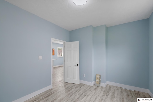 2306 Ogden St, Omaha, NE 68110 - unfurnished room featuring wood finished floors and baseboards