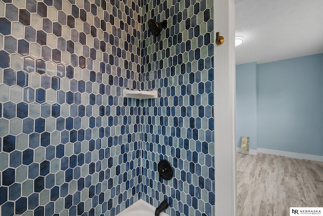 2306 Ogden St, Omaha, NE 68110 - bathroom featuring wood finished floors and shower / bathtub combination
