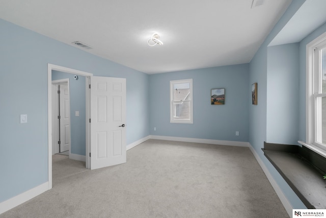 2306 Ogden St, Omaha, NE 68110 - unfurnished bedroom featuring light carpet and baseboards