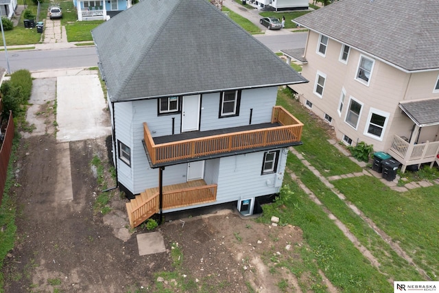 2306 Ogden St, Omaha, NE 68110 - rear view of property with a shingled roof and a yard