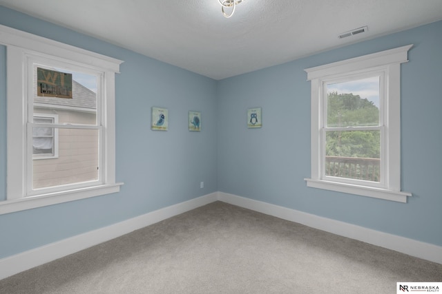 2306 Ogden St, Omaha, NE 68110 - carpeted empty room with baseboards