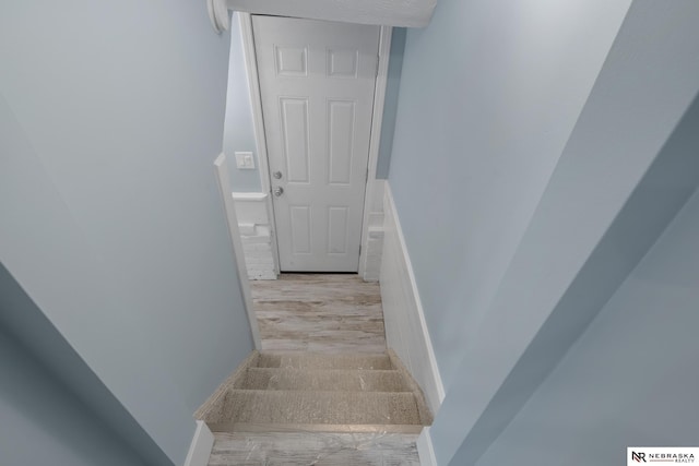 2306 Ogden St, Omaha, NE 68110 - stairs featuring wood finished floors and baseboards