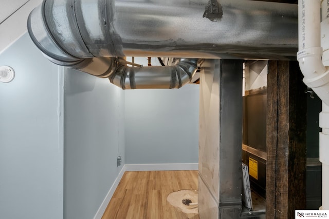 2306 Ogden St, Omaha, NE 68110 - below grade area featuring wood finished floors and baseboards