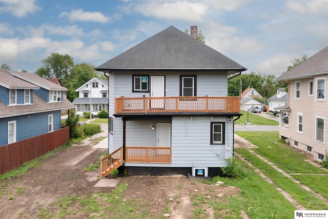 2306 Ogden St, Omaha, NE 68110 - rear view of property with a chimney, a balcony, and a shingled roof