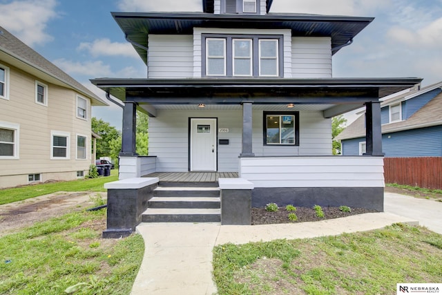 2306 Ogden St, Omaha, NE 68110 - american foursquare style home featuring a porch