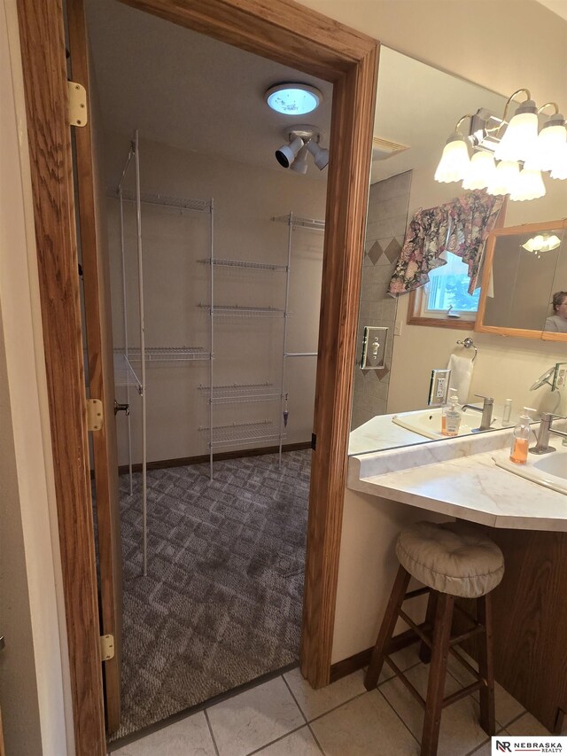 35 E Sandy Ridge Rd, Columbus, NE 68601 - bathroom with tile patterned flooring and vanity