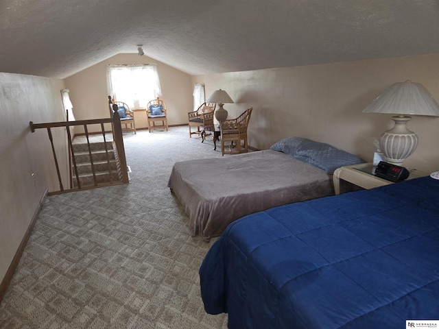 35 E Sandy Ridge Rd, Columbus, NE 68601 - bedroom featuring carpet flooring, lofted ceiling, a textured ceiling, and baseboards