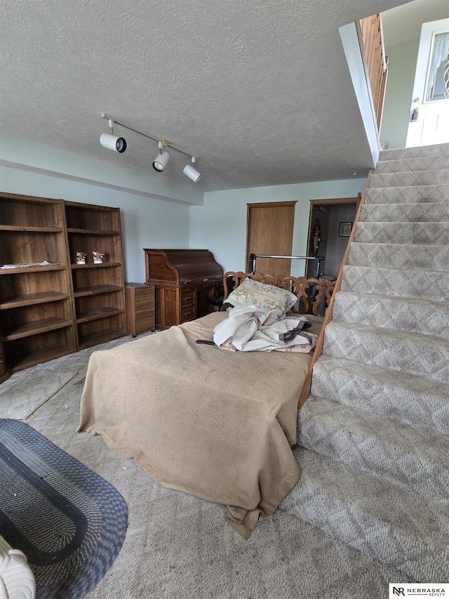 35 E Sandy Ridge Rd, Columbus, NE 68601 - carpeted bedroom featuring a textured ceiling