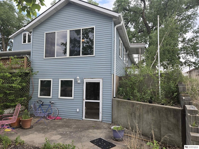 35 E Sandy Ridge Rd, Columbus, NE 68601 - rear view of property with a patio