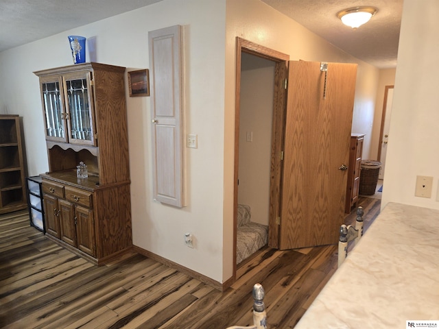 35 E Sandy Ridge Rd, Columbus, NE 68601 - corridor with dark wood finished floors and baseboards
