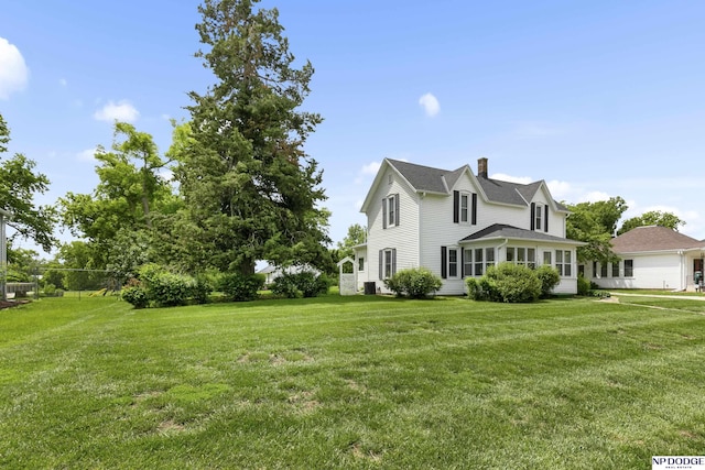 1373 S St, Blair, NE 68008 - view of property exterior with a chimney and a yard