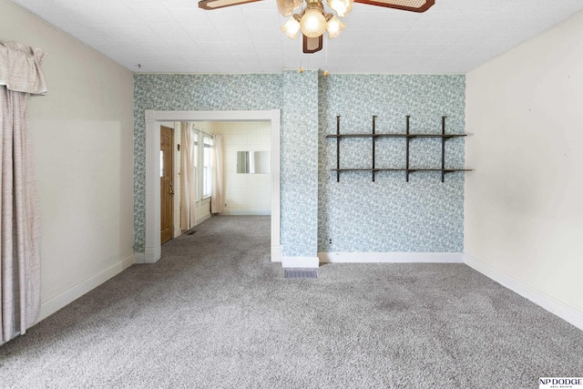 1373 S St, Blair, NE 68008 - unfurnished living room featuring carpet flooring, a ceiling fan, and baseboards