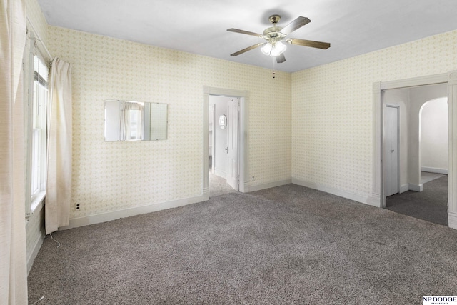 1373 S St, Blair, NE 68008 - carpeted spare room with ceiling fan, arched walkways, and baseboards