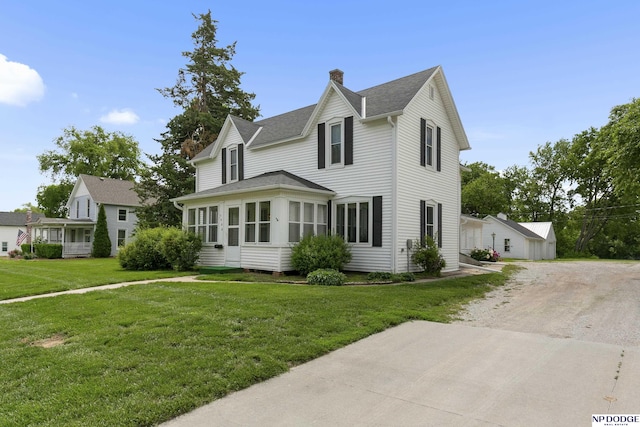 1373 S St, Blair, NE 68008 - view of front of home featuring a chimney, a front lawn, a shingled roof, and dirt driveway