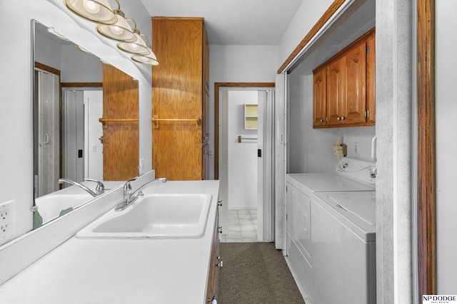 1373 S St, Blair, NE 68008 - washroom featuring washing machine and dryer and cabinet space