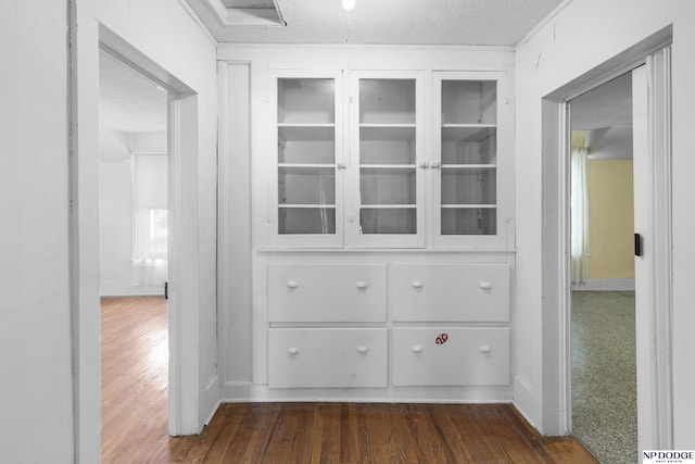 1373 S St, Blair, NE 68008 - corridor with dark wood-style flooring, a textured ceiling, and baseboards