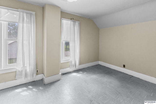 1373 S St, Blair, NE 68008 - bonus room with baseboards and lofted ceiling