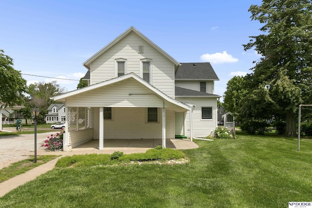 1373 S St, Blair, NE 68008 - view of front of home featuring a front lawn, roof with shingles, and a patio