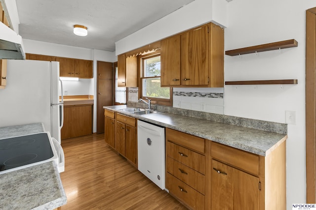 9607 Spencer St, Omaha, NE 68134 - kitchen with a sink, white appliances, range hood, light wood-type flooring, and brown cabinetry