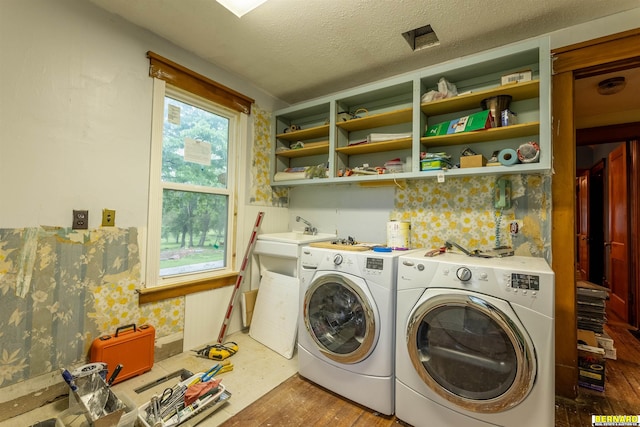 102 Eldon St, Talmage, NE 68448 - washroom with washing machine and dryer, wood finished floors, a textured ceiling, and wallpapered walls