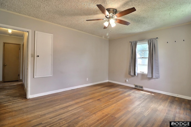 1827 E Broad St, Fremont, NE 68025 - spare room featuring a ceiling fan, wood finished floors, a textured ceiling, baseboards, and crown molding