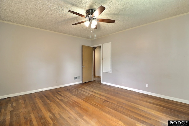 1827 E Broad St, Fremont, NE 68025 - unfurnished room with a ceiling fan, crown molding, a textured ceiling, wood finished floors, and baseboards