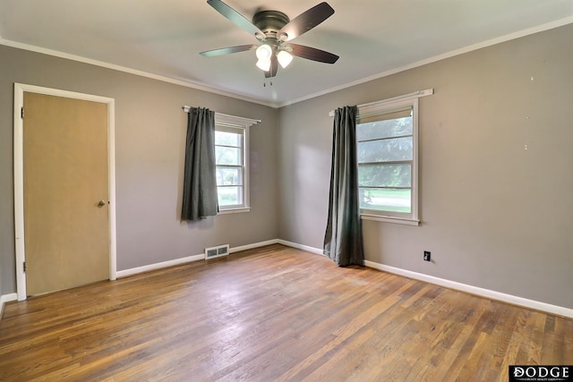 1827 E Broad St, Fremont, NE 68025 - spare room with ceiling fan, wood finished floors, baseboards, and ornamental molding