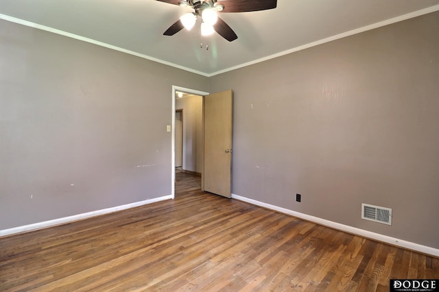 1827 E Broad St, Fremont, NE 68025 - spare room featuring baseboards, a ceiling fan, wood finished floors, and crown molding