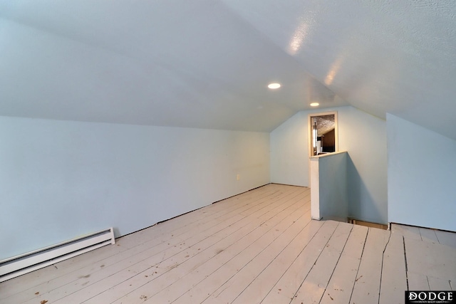 1827 E Broad St, Fremont, NE 68025 - bonus room featuring a baseboard radiator, vaulted ceiling, wood finished floors, and recessed lighting