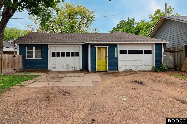 1827 E Broad St, Fremont, NE 68025 - view of front of property featuring an outdoor structure and a shingled roof
