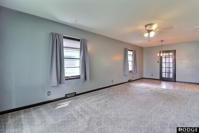 1827 E Broad St, Fremont, NE 68025 - unfurnished room featuring carpet, baseboards, and a ceiling fan