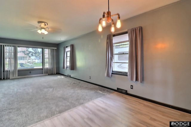 1827 E Broad St, Fremont, NE 68025 - spare room with plenty of natural light, baseboards, wood finished floors, and ceiling fan