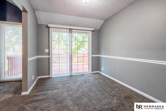 15161 R St, Omaha, NE 68137 - carpeted empty room with lofted ceiling, a textured ceiling, and baseboards