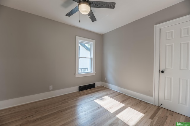 5515 Hickory St, Omaha, NE 68106 - empty room with ceiling fan, light wood finished floors, and baseboards