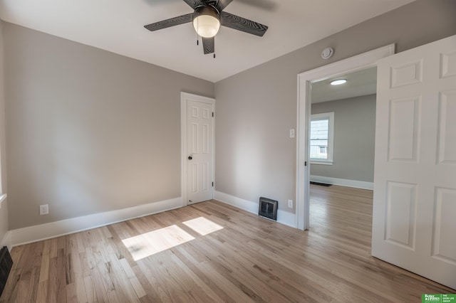 5515 Hickory St, Omaha, NE 68106 - spare room featuring a ceiling fan, wood finished floors, baseboards, and a smoke detector