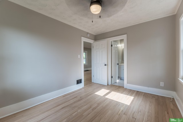 5515 Hickory St, Omaha, NE 68106 - unfurnished room featuring light wood finished floors, baseboards, a ceiling fan, and crown molding