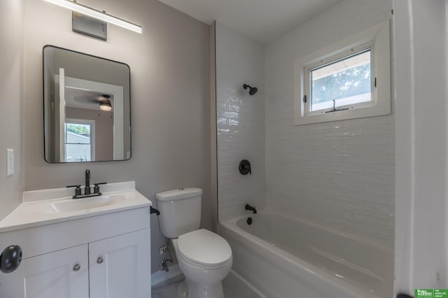 5515 Hickory St, Omaha, NE 68106 - bathroom featuring toilet, plenty of natural light, vanity, and tub / shower combination