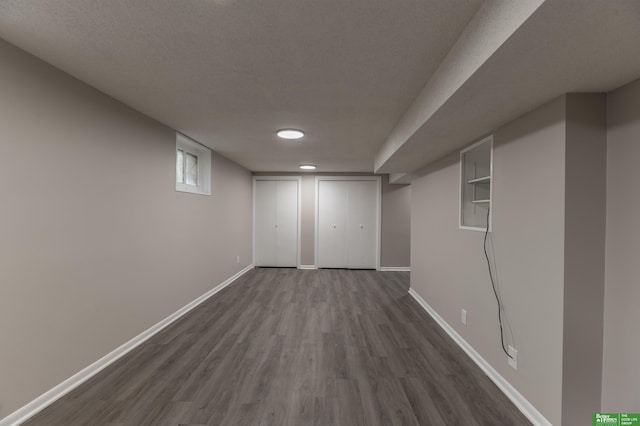 5515 Hickory St, Omaha, NE 68106 - below grade area featuring baseboards, dark wood finished floors, and recessed lighting