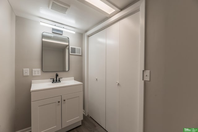 5515 Hickory St, Omaha, NE 68106 - bathroom featuring vanity and wood finished floors
